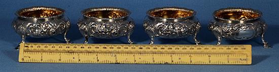 A set of four Victorian embossed silver table salts, by Roberts & Briggs, height 47mm, weight 12.8oz/401grms.